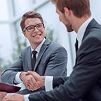 close up. young businessman and lawyer shaking hands. concept of cooperation